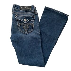 Rock Revival Women’s Debbie Boot Cut Distressed Jeans.